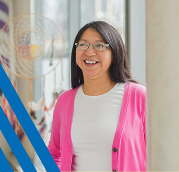 Asian woman in glasses smiling