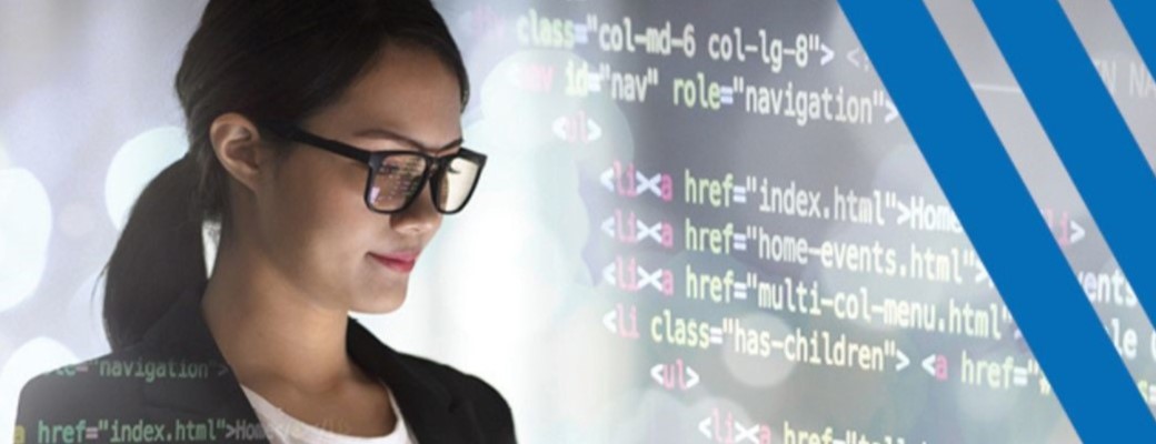 Woman in glasses looking at computer screen.