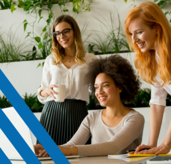 Three women looking at laptop